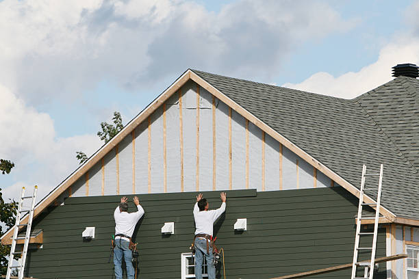 Professional Siding technician working in Newtown, VA